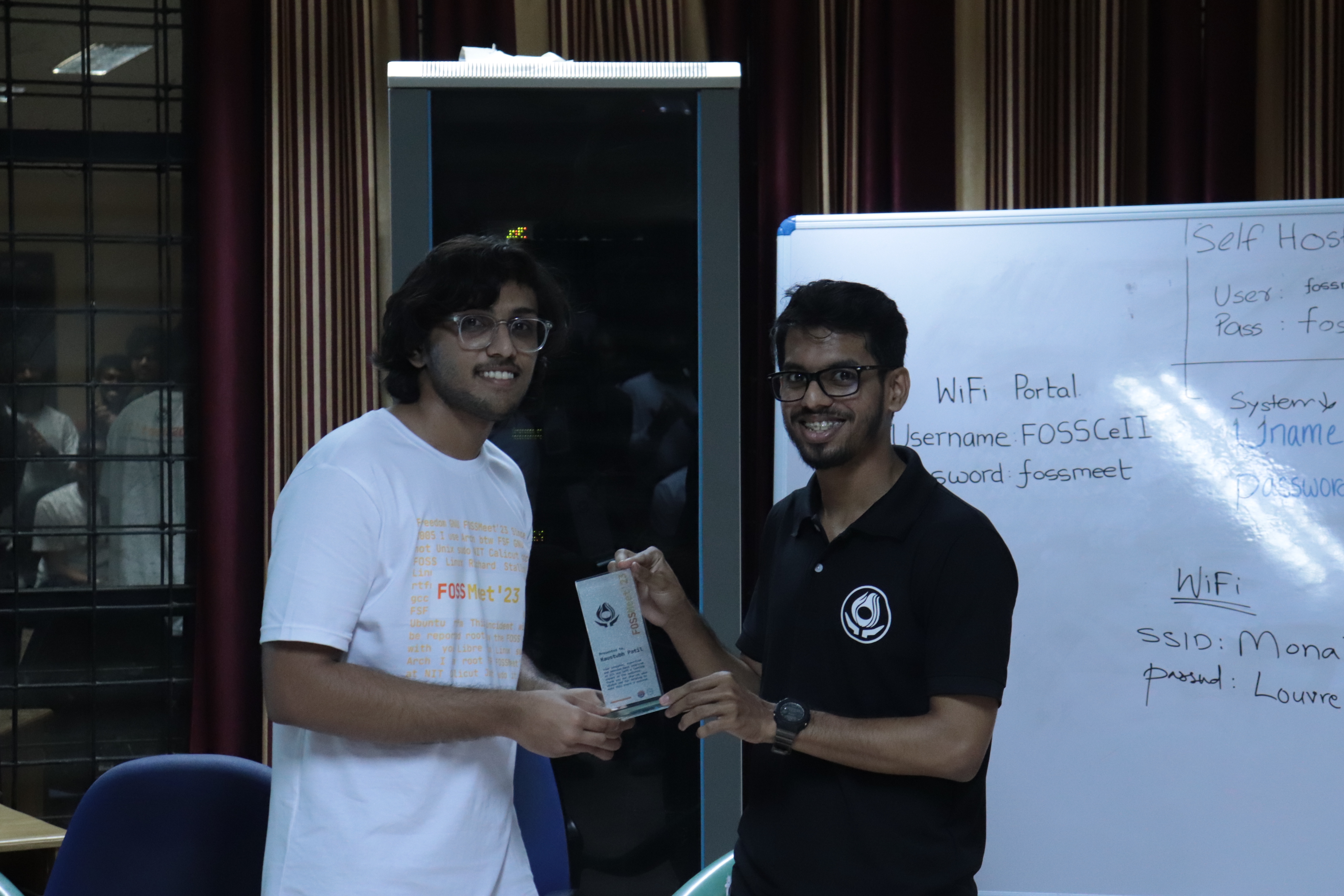 Me (left) accepitng a momento from Hadif (right), one of the two NITC students on my team